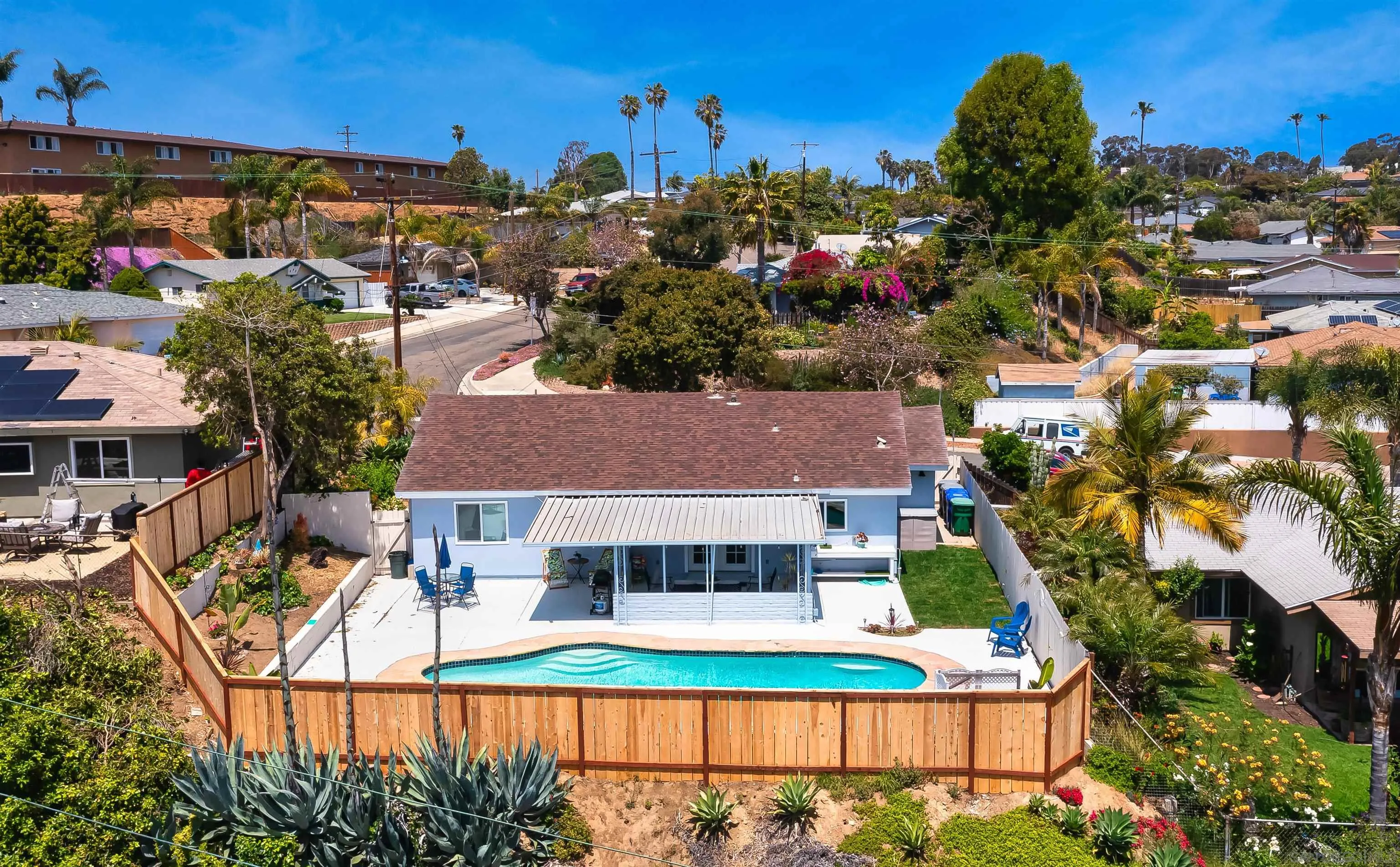 Undisclosed Address Oceanside, CA 92054 - Photo 2 of 19 a view of houses with an outdoor space and seating
