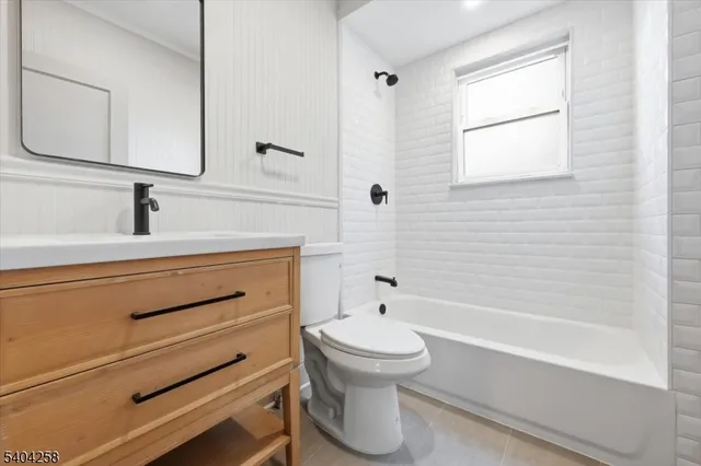 a bathroom with a sink a toilet and bathtub