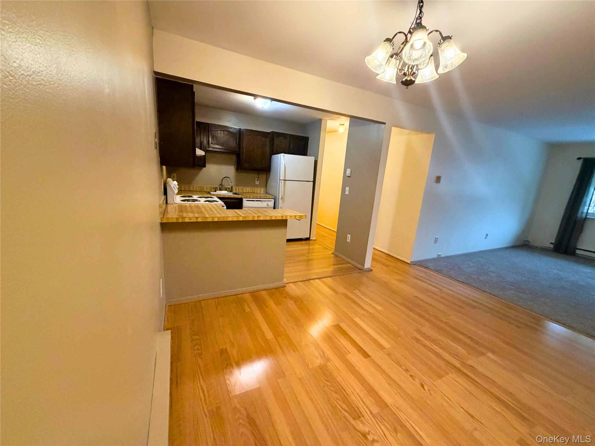 11 Patterson Village Court Patterson, NY 12563 - Photo 3 of 12 a view of a bedroom with a bed and wooden floor