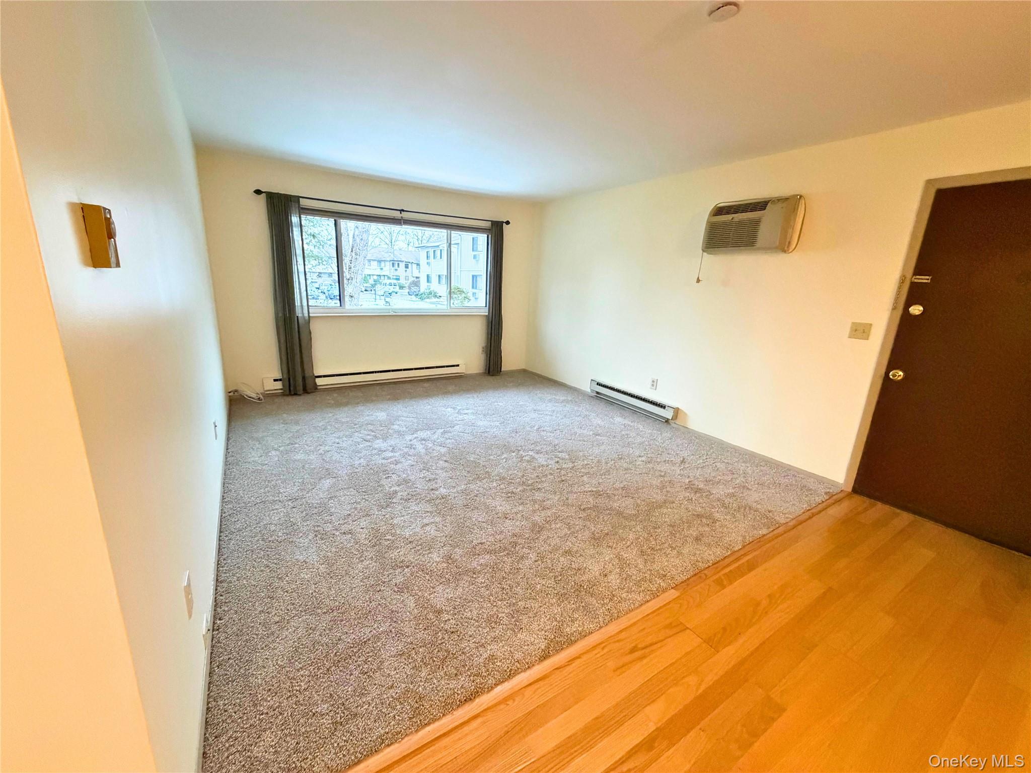 11 Patterson Village Court Patterson, NY 12563 - Photo 6 of 12 a view of an empty room with a window