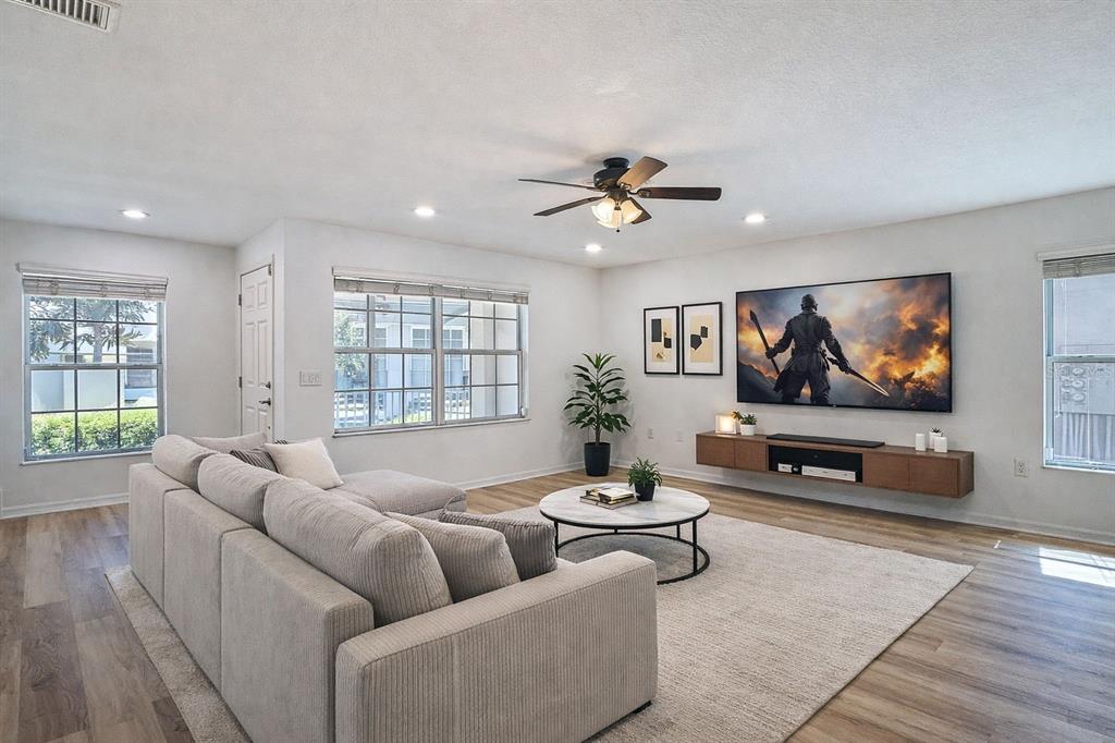 5101 Chipotle Lane Wesley Chapel, FL 33544 - Photo 11 of 25 a living room with furniture and a flat screen tv