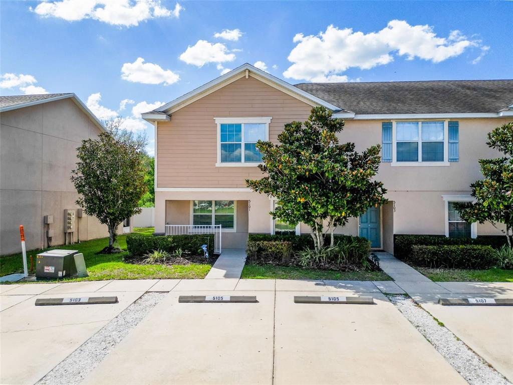5101 Chipotle Lane Wesley Chapel, FL 33544 - Photo 2 of 25 a front view of a house with garden