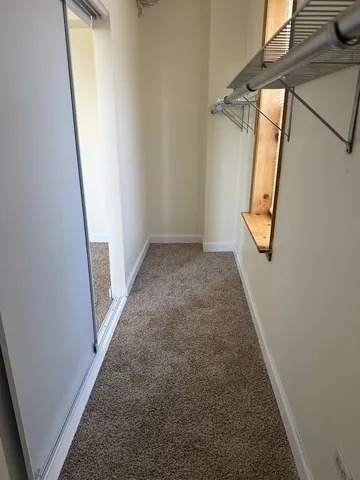 a bathroom with a sink a toilet a mirror and shower