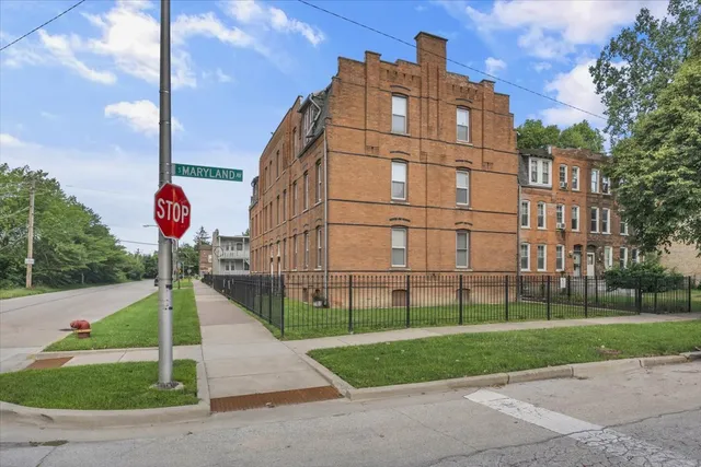 a front view of a building with garden