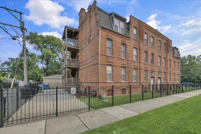 a view of a building with a yard