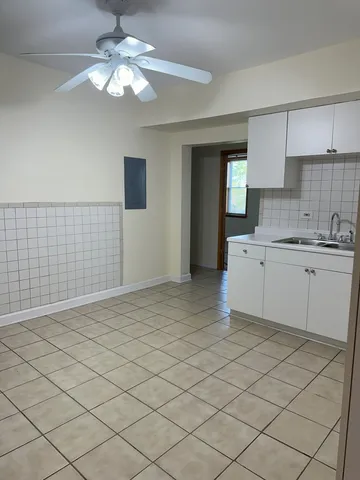 a kitchen with a sink cabinets and appliances