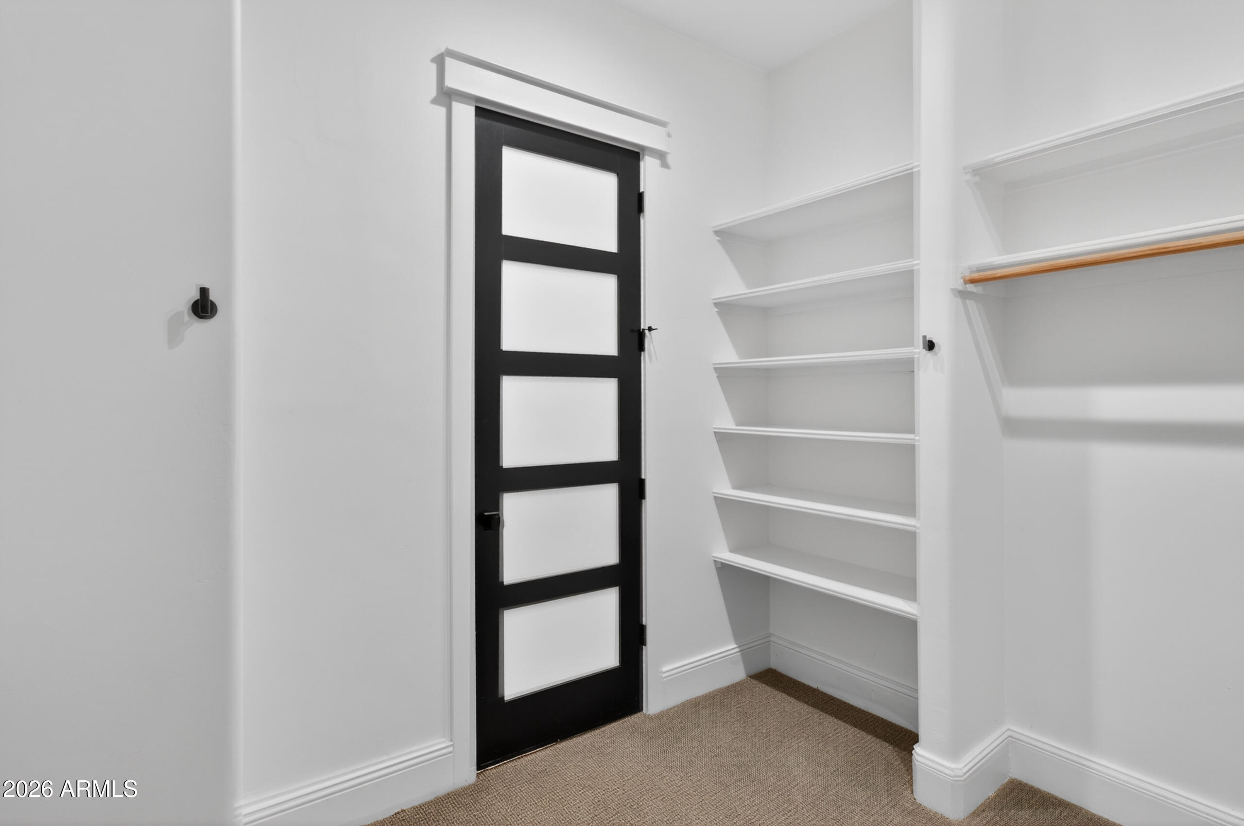 2677 East Queen Creek Road Gilbert, AZ 85297 - Photo 60 of 128 a view of an empty room with empty racks