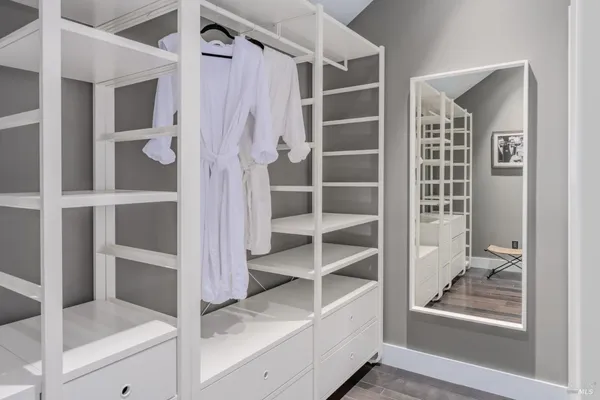 a bathroom with a sink a toilet a shower and a mirror