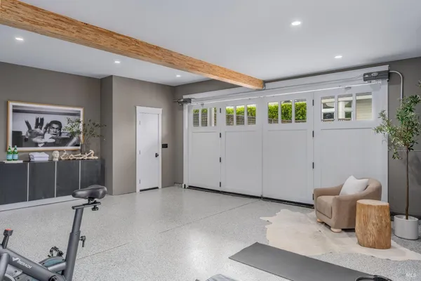 a view of a patio with couches and a table and chairs