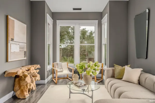 a living room with furniture and a large window