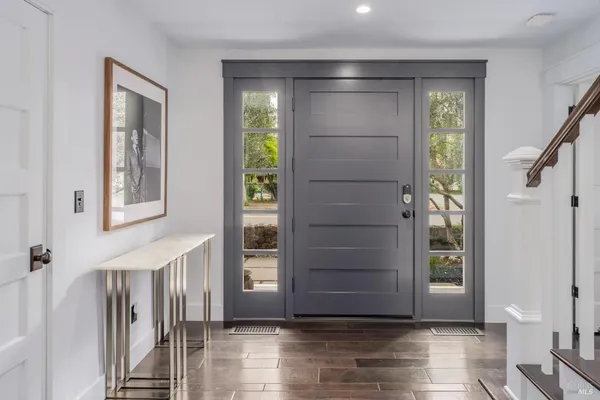 a view of entryway with wooden floor
