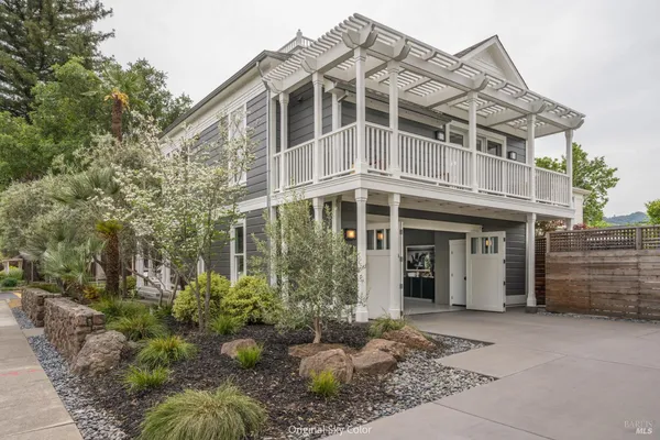 a balcony with furniture and a potted plant