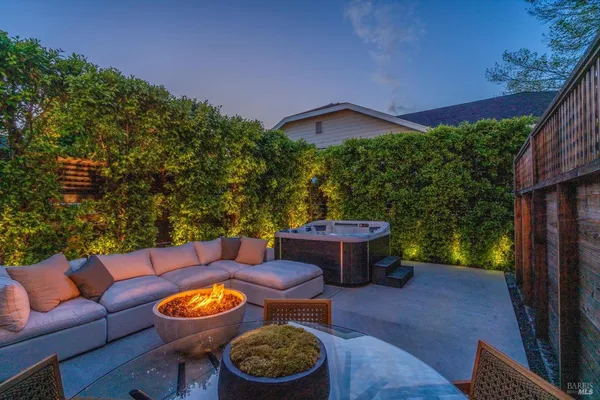 a kitchen with a sink cabinets and wooden floor