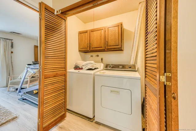 a bathroom with a sink a mirror and a shower curtain
