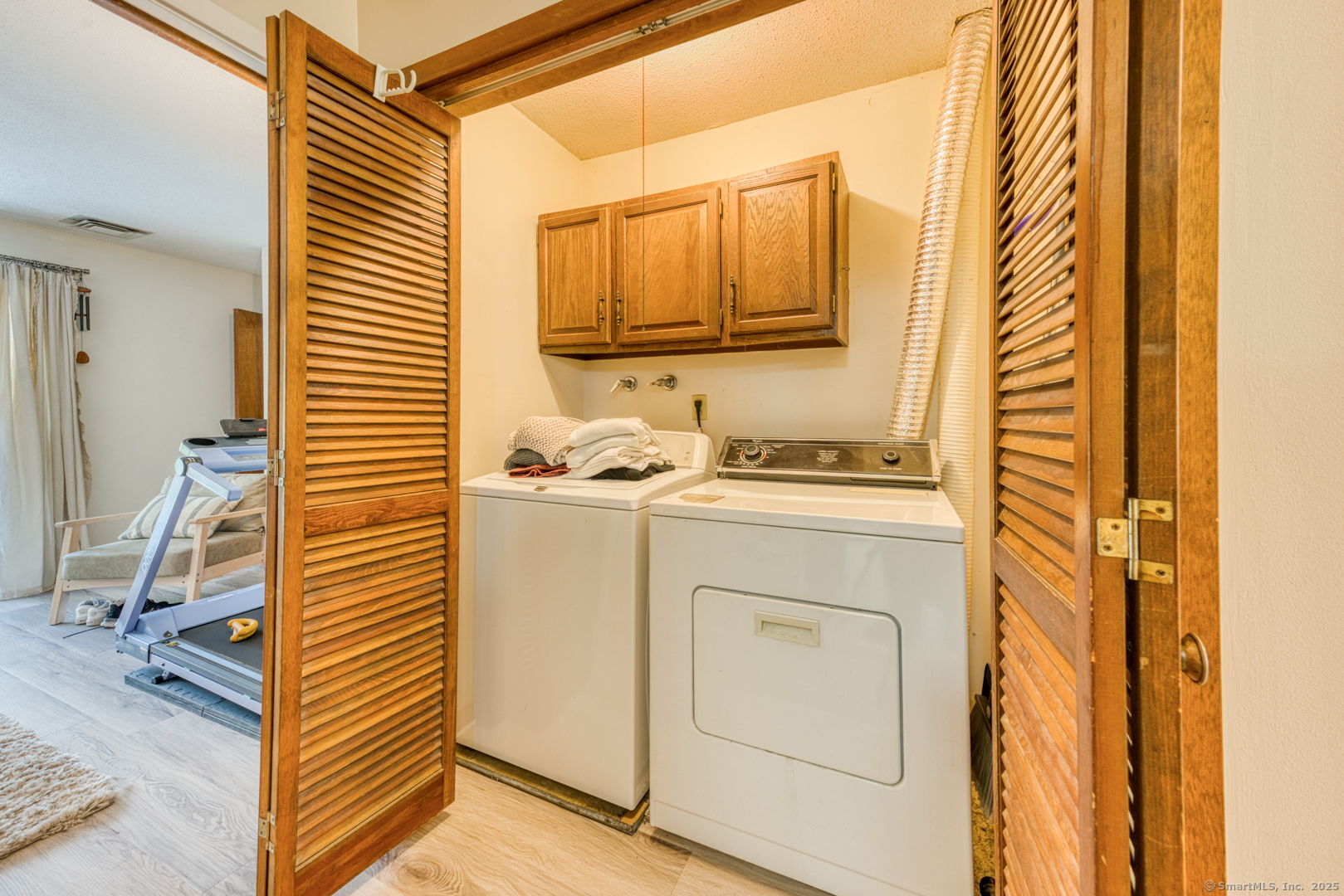 10 Deepwood Drive, Unit 10 Southington, CT 06489 - Photo 13 of 31 a bathroom with a sink a mirror and a shower curtain
