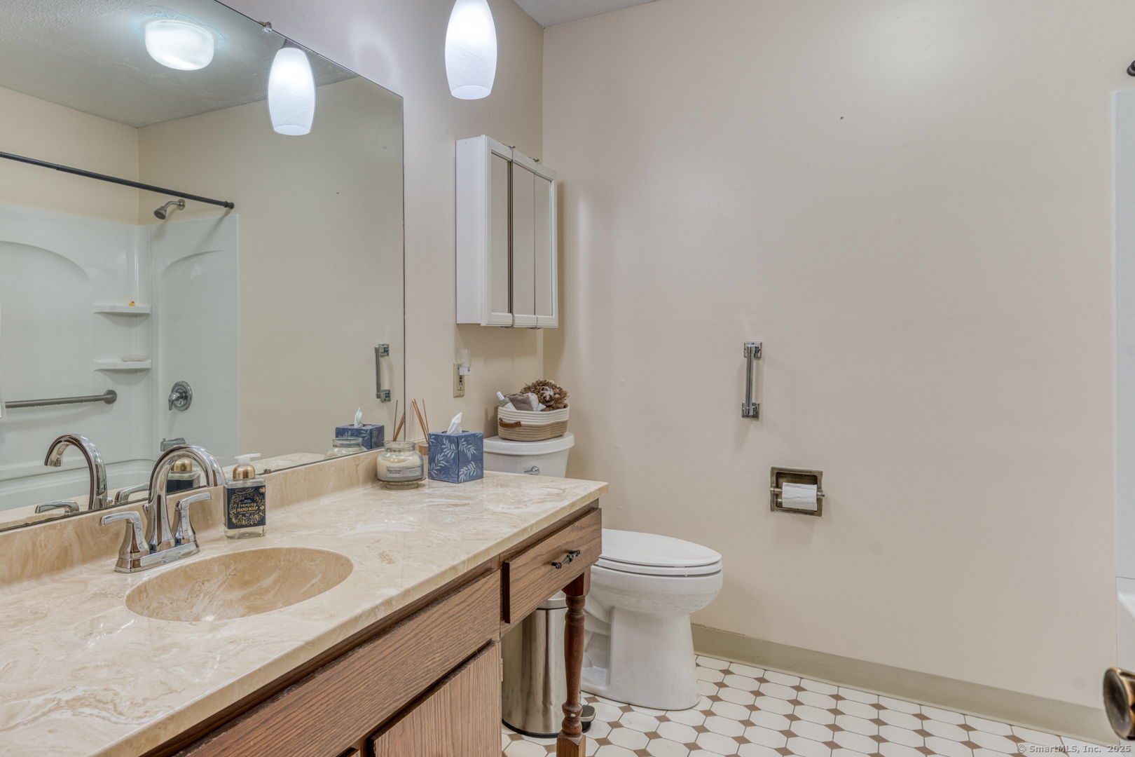 10 Deepwood Drive, Unit 10 Southington, CT 06489 - Photo 14 of 31 a bathroom with a granite countertop sink a toilet and a mirror