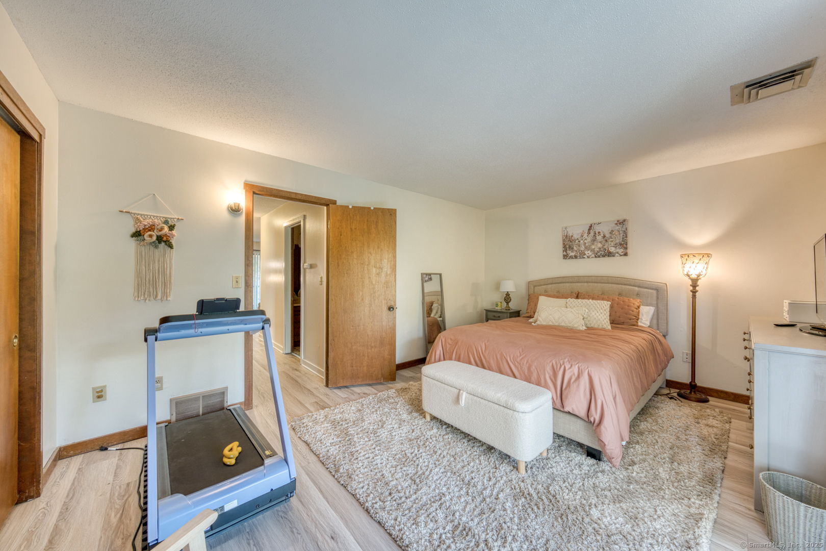 10 Deepwood Drive, Unit 10 Southington, CT 06489 - Photo 16 of 31 a bedroom with a bed and a couch