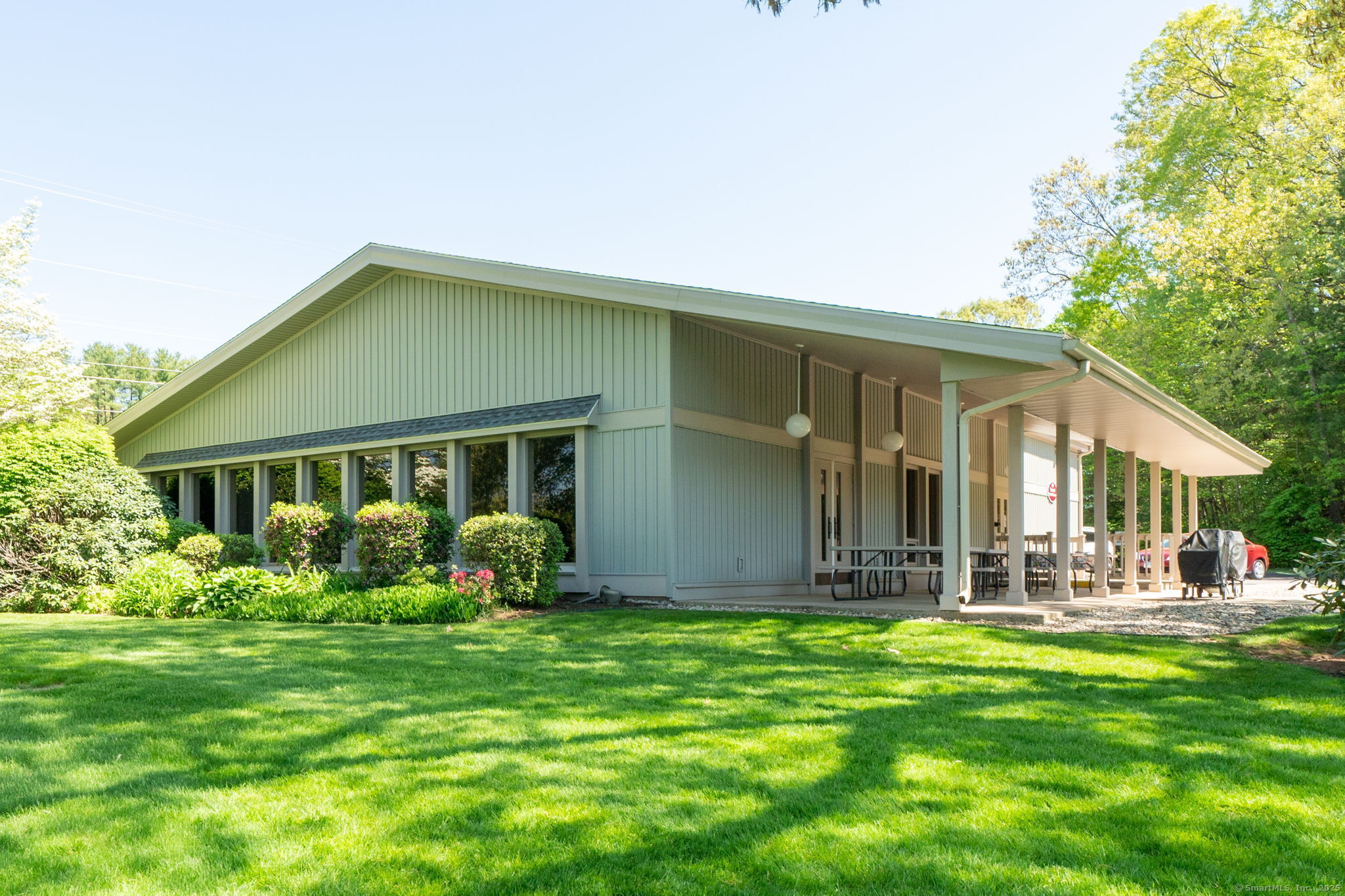 10 Deepwood Drive, Unit 10 Southington, CT 06489 - Photo 24 of 31 a front view of house with yard and green space
