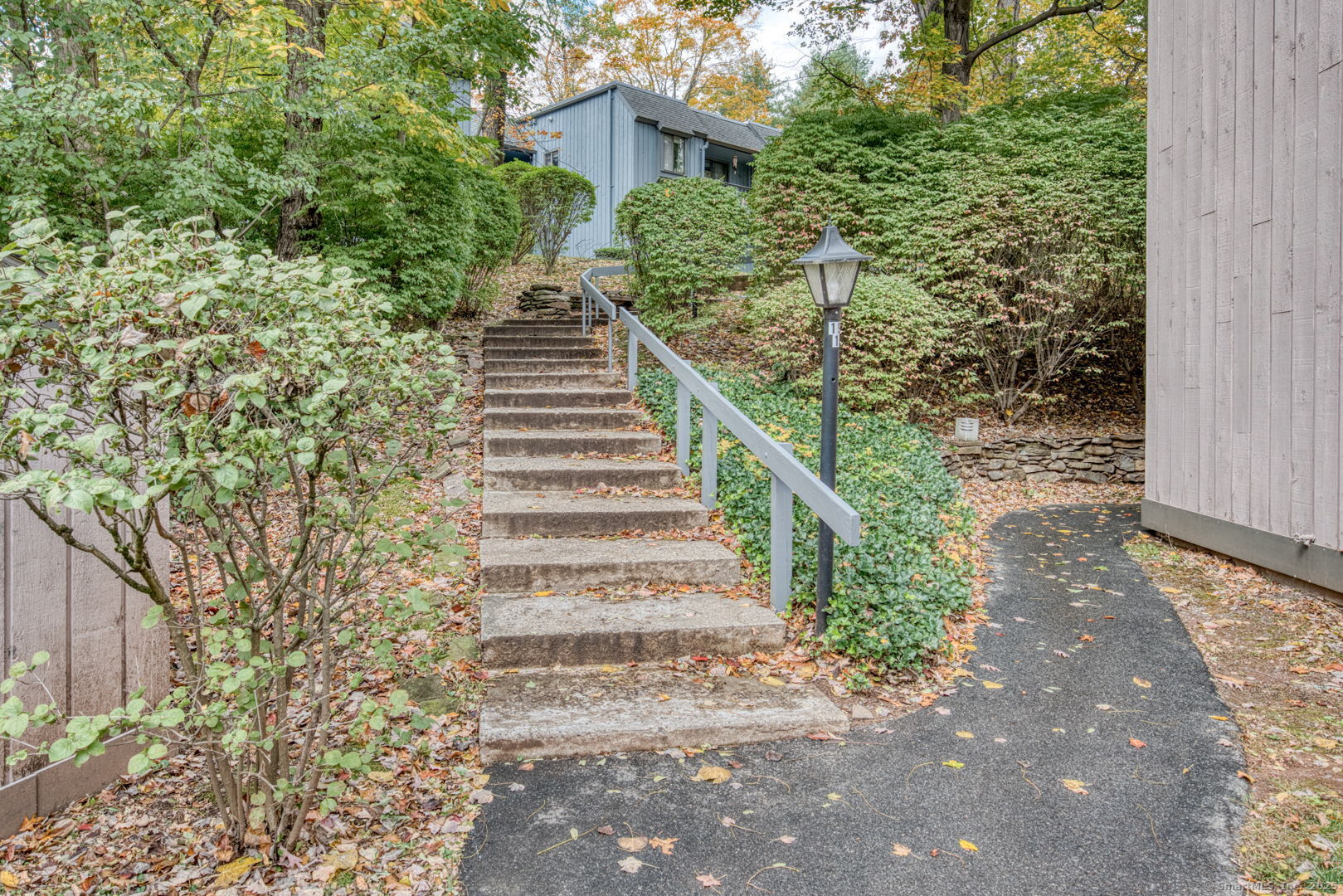 10 Deepwood Drive, Unit 10 Southington, CT 06489 - Photo 26 of 31 a view of a yard with plants and large trees
