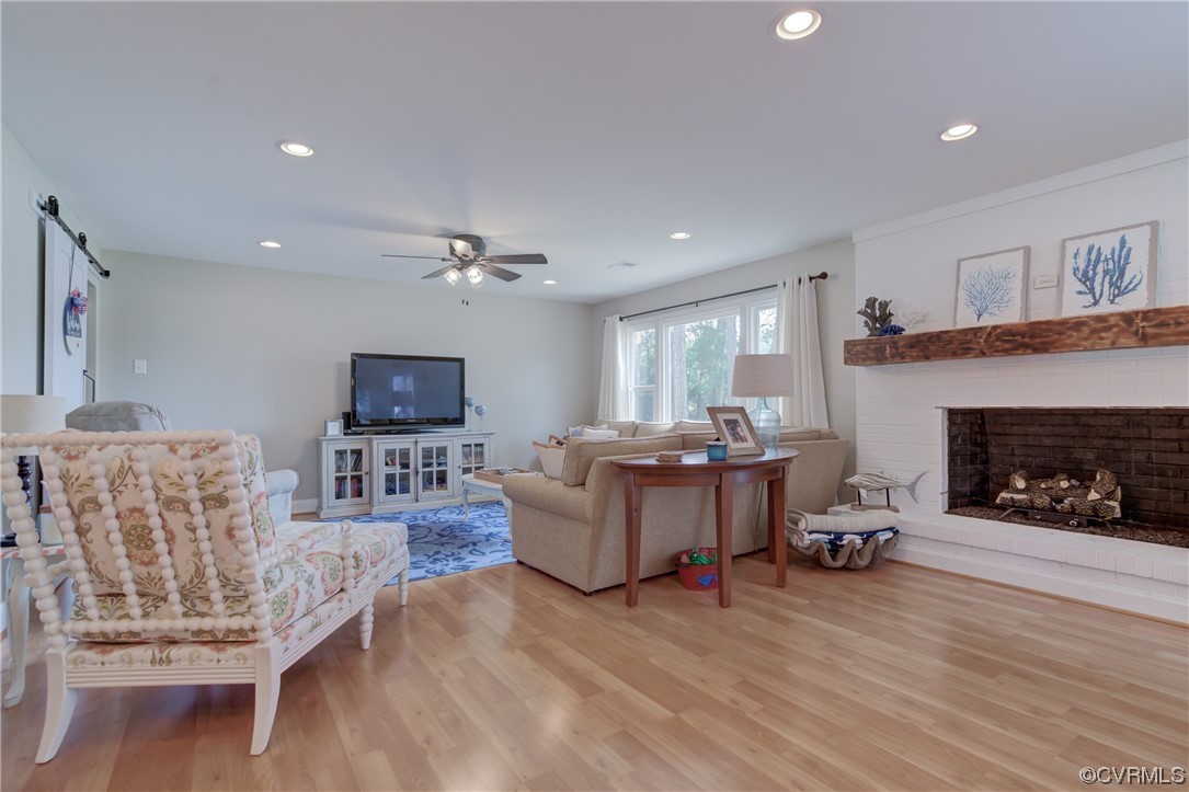 20 South Sioux Road Kilmarnock, VA 22482 - Photo 17 of 46 a living room with furniture and a fireplace