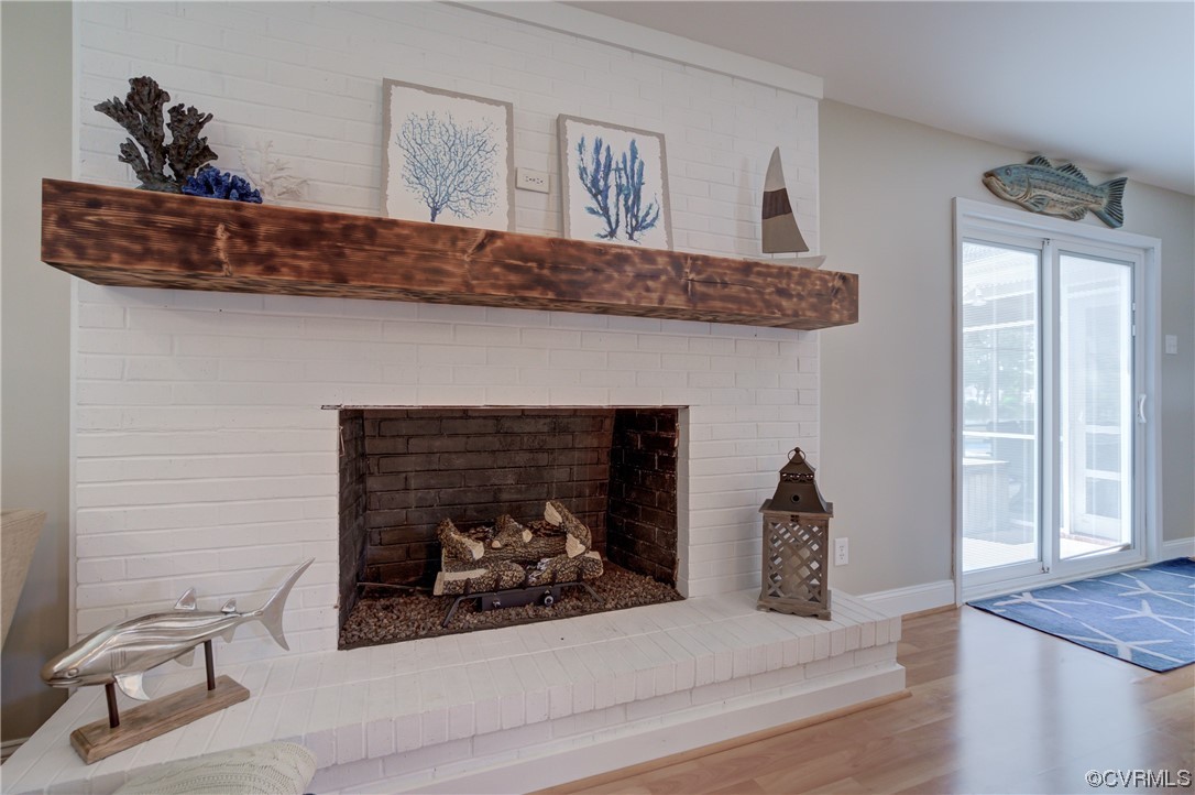 20 South Sioux Road Kilmarnock, VA 22482 - Photo 19 of 46 a living room with furniture and a fireplace
