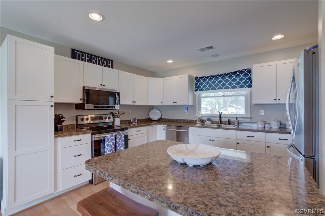20 South Sioux Road Kilmarnock, VA 22482 - Photo 23 of 46 a large kitchen with cabinets appliances and a counter space