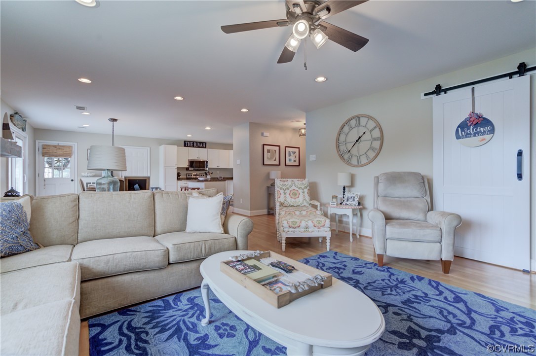 20 South Sioux Road Kilmarnock, VA 22482 - Photo 26 of 46 a living room with furniture and a table