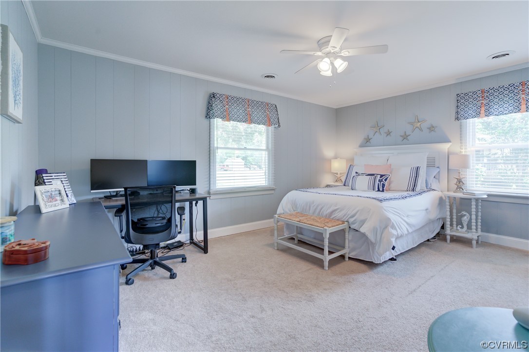 20 South Sioux Road Kilmarnock, VA 22482 - Photo 28 of 46 a spacious bedroom with a bed and a chandelier