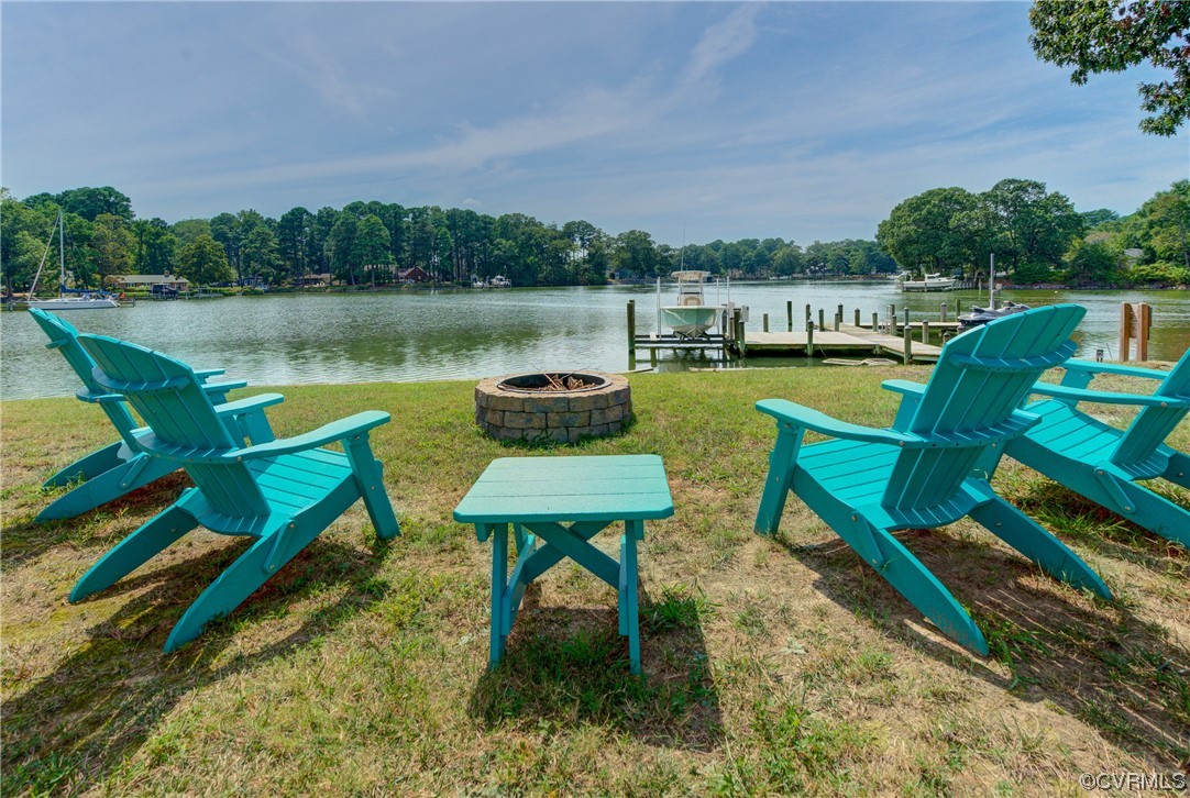 20 South Sioux Road Kilmarnock, VA 22482 - Photo 9 of 46 a view of a chairs and table on the deck