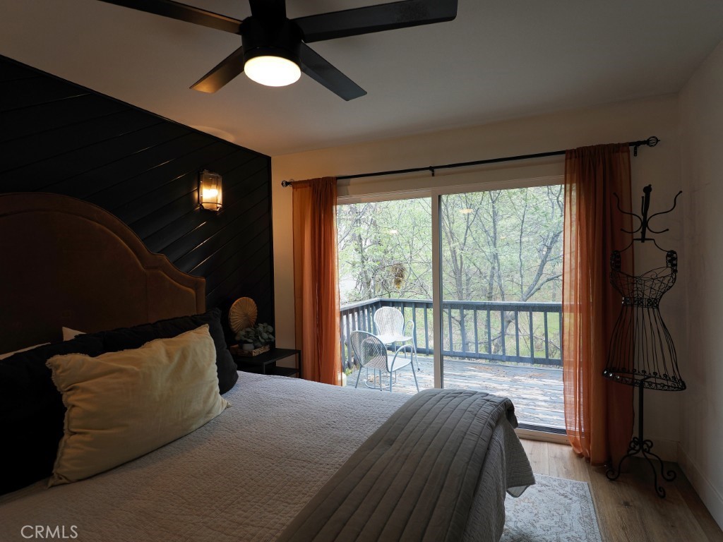 28596 North Bay Road Lake Arrowhead, CA 92352 - Photo 53 of 69 a bedroom with a bed and a large window