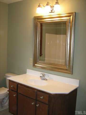 1108 Bahama Road Bahama, NC 27503 - Photo 6 of 10 1ST FLOOR BATHROOM HAS FRESH PAINT, NEW MIRROR, NEW COUNTERTOP, NEW LIGHTING & NEW CARAMIC TILE FLOORING! Other