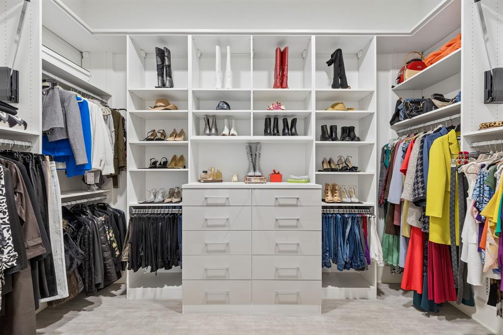 548 Oak Grove Lane Coppell, TX 75019 - Photo 22 of 36 a view of walk in closet with clothes and shoes