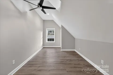a bathroom with a granite countertop toilet a sink and a bathtub