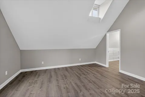 a view of a big room with closet and windows