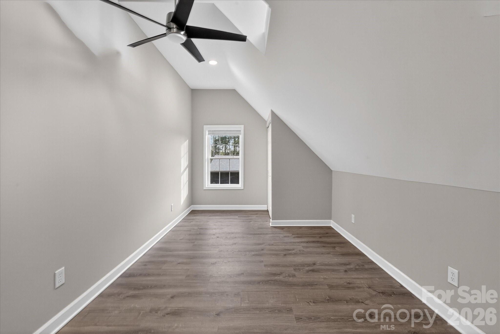 2221 Waxhaw-Marvin Road Waxhaw, NC 28173 - Photo 15 of 30 a view of an empty room with wooden floor and a window