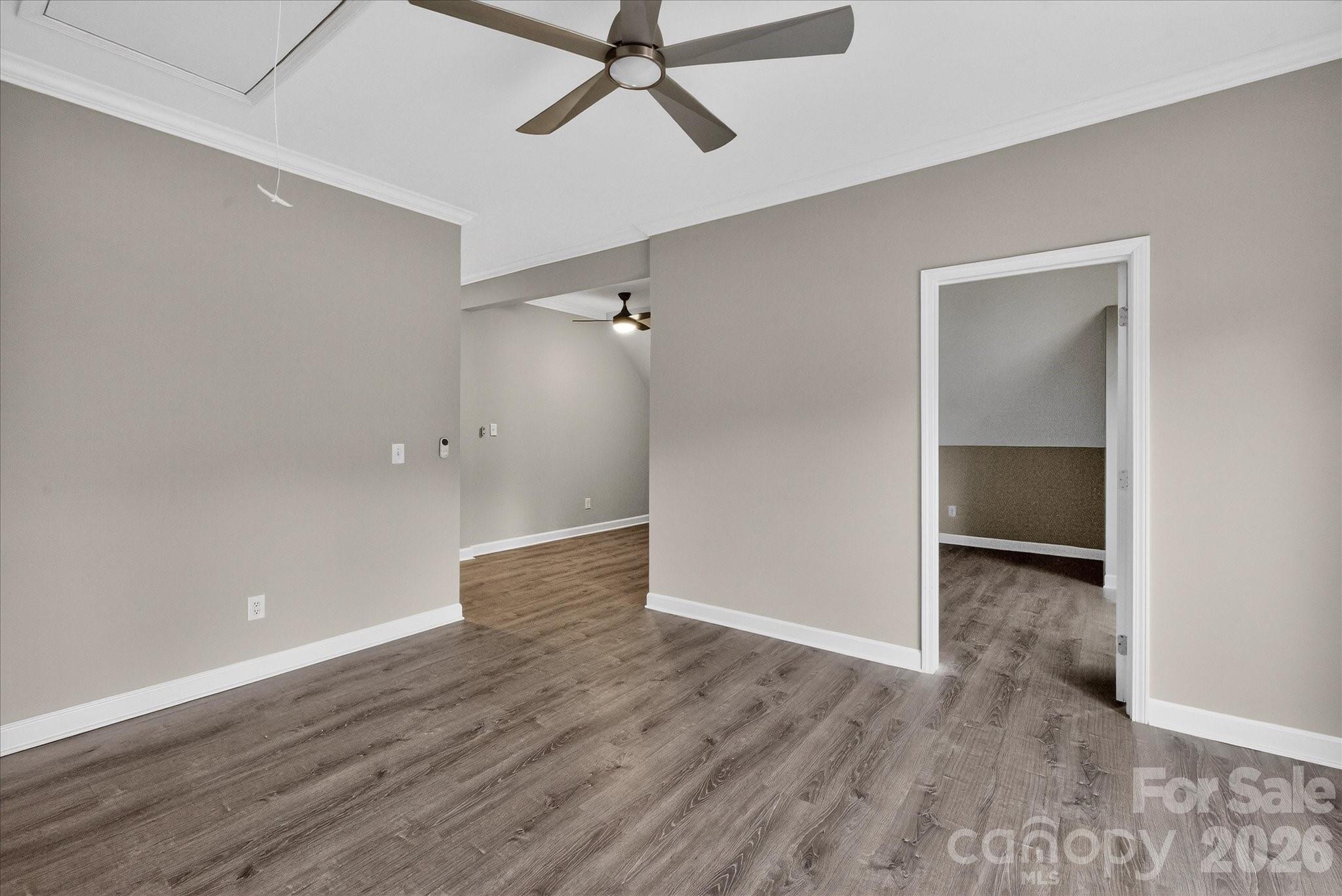 2221 Waxhaw-Marvin Road Waxhaw, NC 28173 - Photo 16 of 30 an empty room with wooden floor and windows