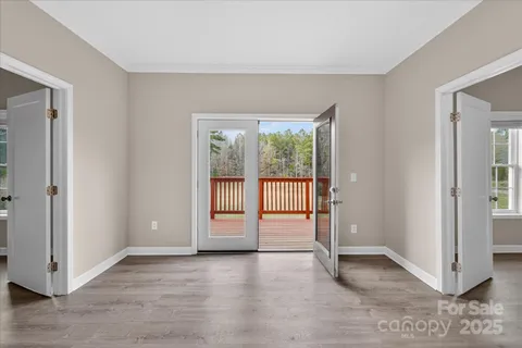 a view of a field with a tree in the background