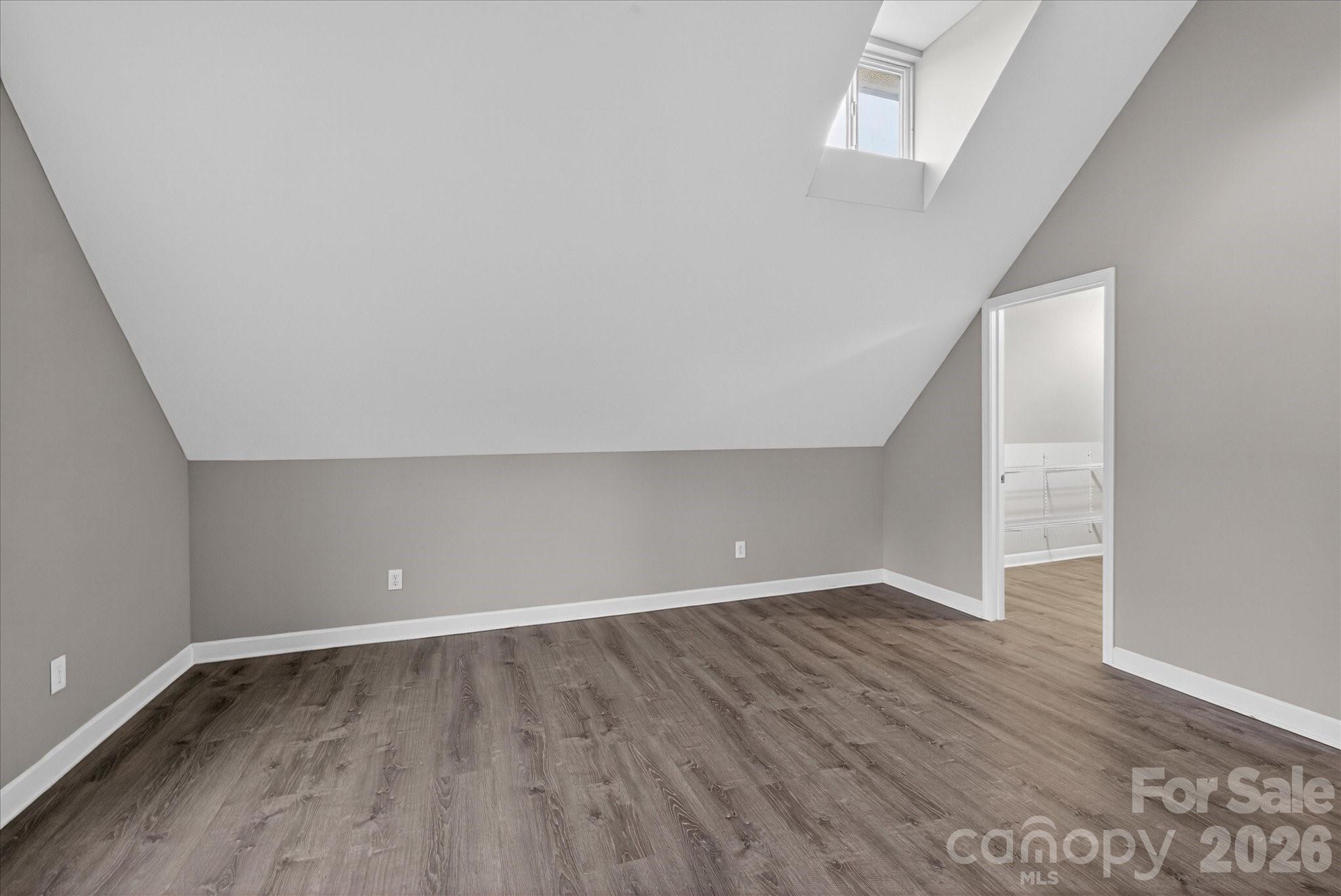 2221 Waxhaw-Marvin Road Waxhaw, NC 28173 - Photo 18 of 30 a view of an empty room with wooden floor and a window