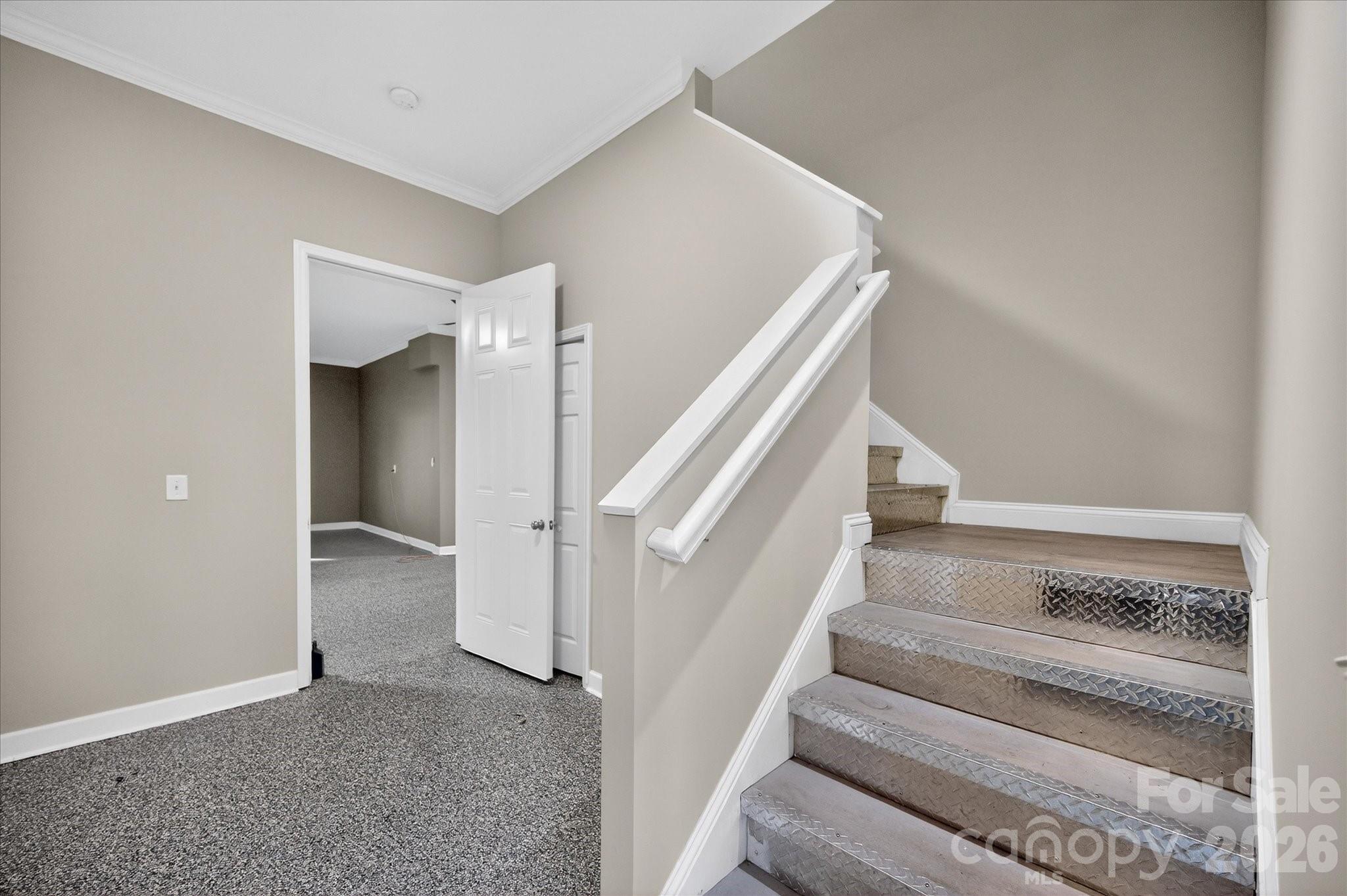 2221 Waxhaw-Marvin Road Waxhaw, NC 28173 - Photo 24 of 30 a view of staircase with white walls and white walls
