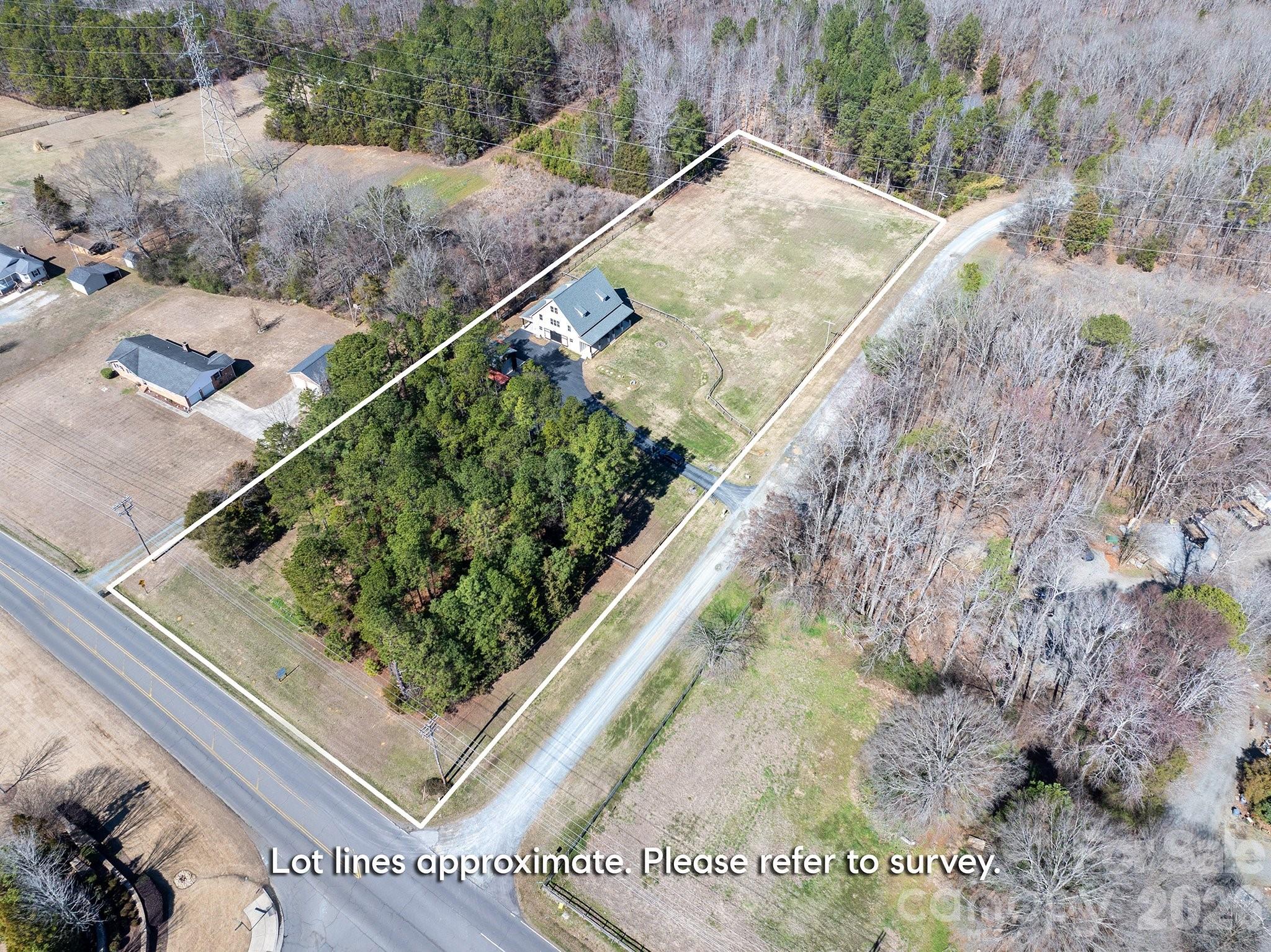 2221 Waxhaw-Marvin Road Waxhaw, NC 28173 - Photo 4 of 30 a view of a yard with wooden fence
