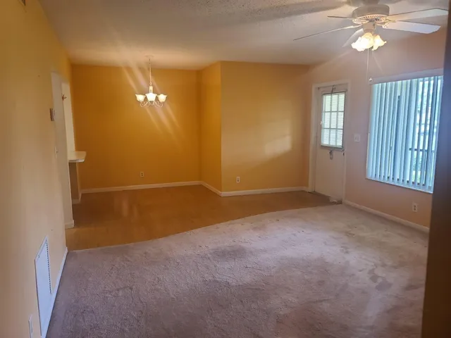 an empty room with a fireplace