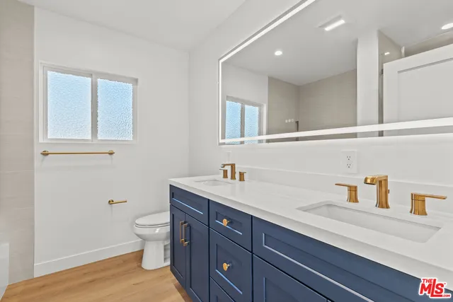 a white bath tub sitting next to a shower