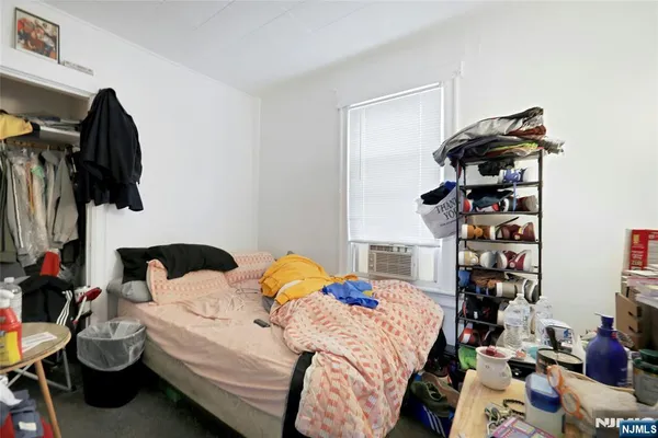 a bedroom with a bed and a fireplace