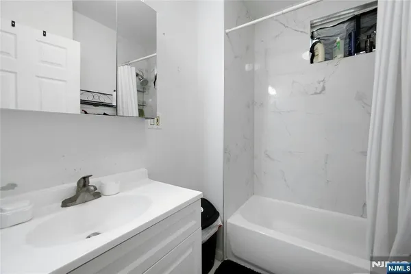 a bathroom with a sink and a bathtub