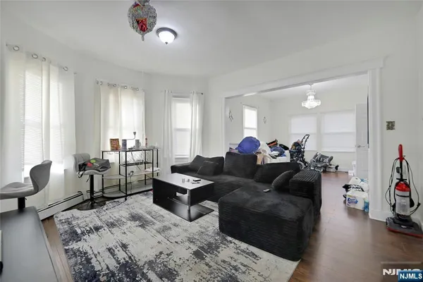 a living room with furniture and a large window