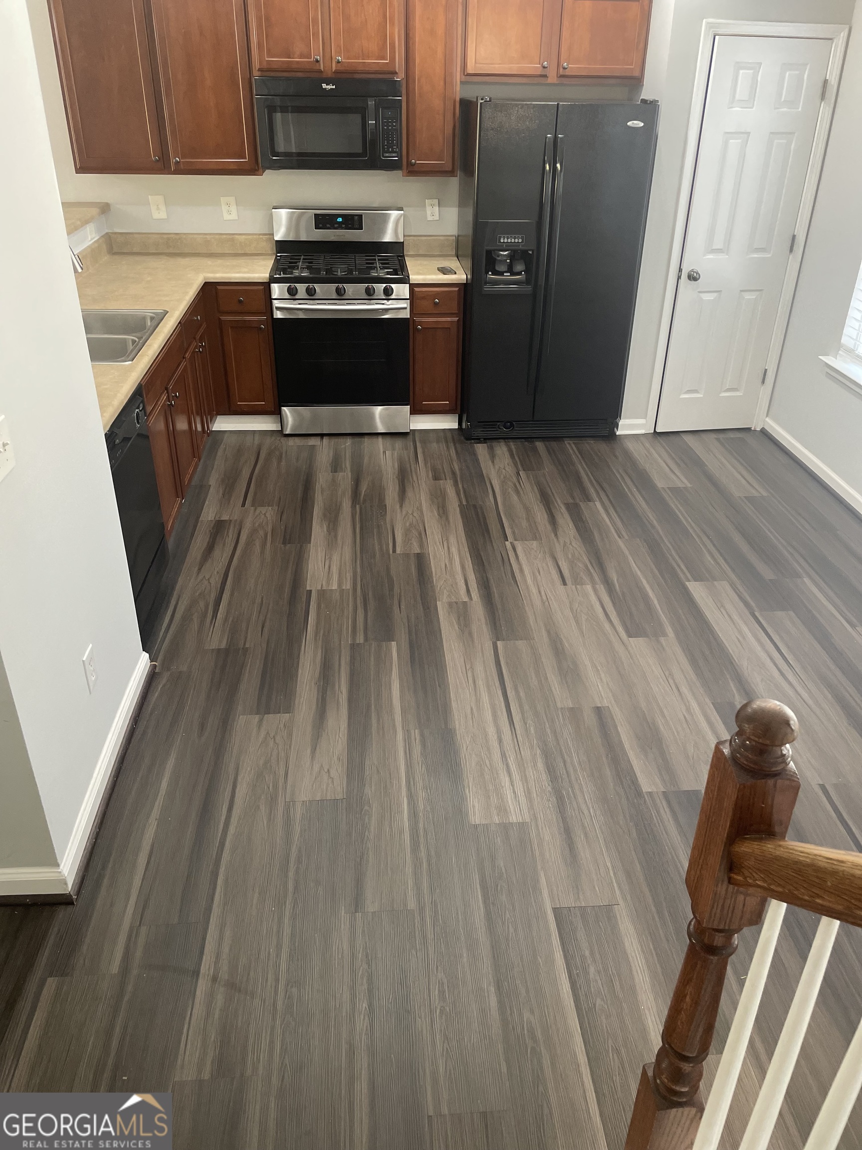 3640 Utoy Drive Southwest South Fulton, GA 30331 - Photo 12 of 26 a kitchen with a sink and refrigerator