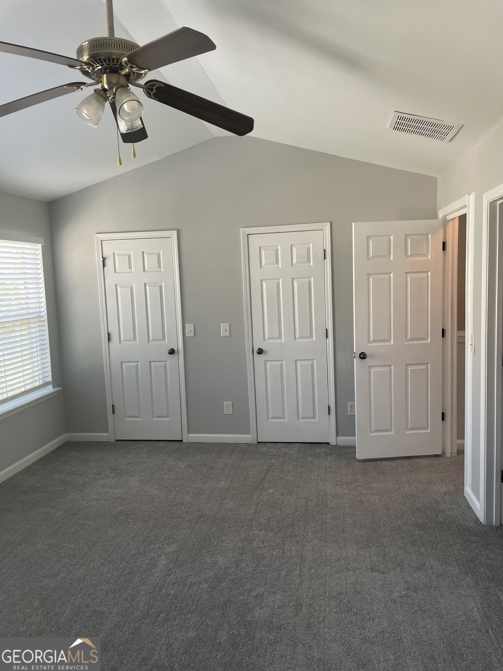 3640 Utoy Drive Southwest South Fulton, GA 30331 - Photo 15 of 26 a view of empty room with a window and a ceiling fan