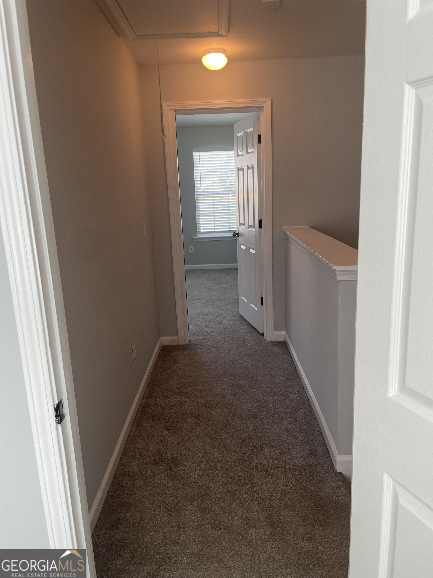 3640 Utoy Drive Southwest South Fulton, GA 30331 - Photo 16 of 26 a view of a hallway with wooden floor and a bathroom