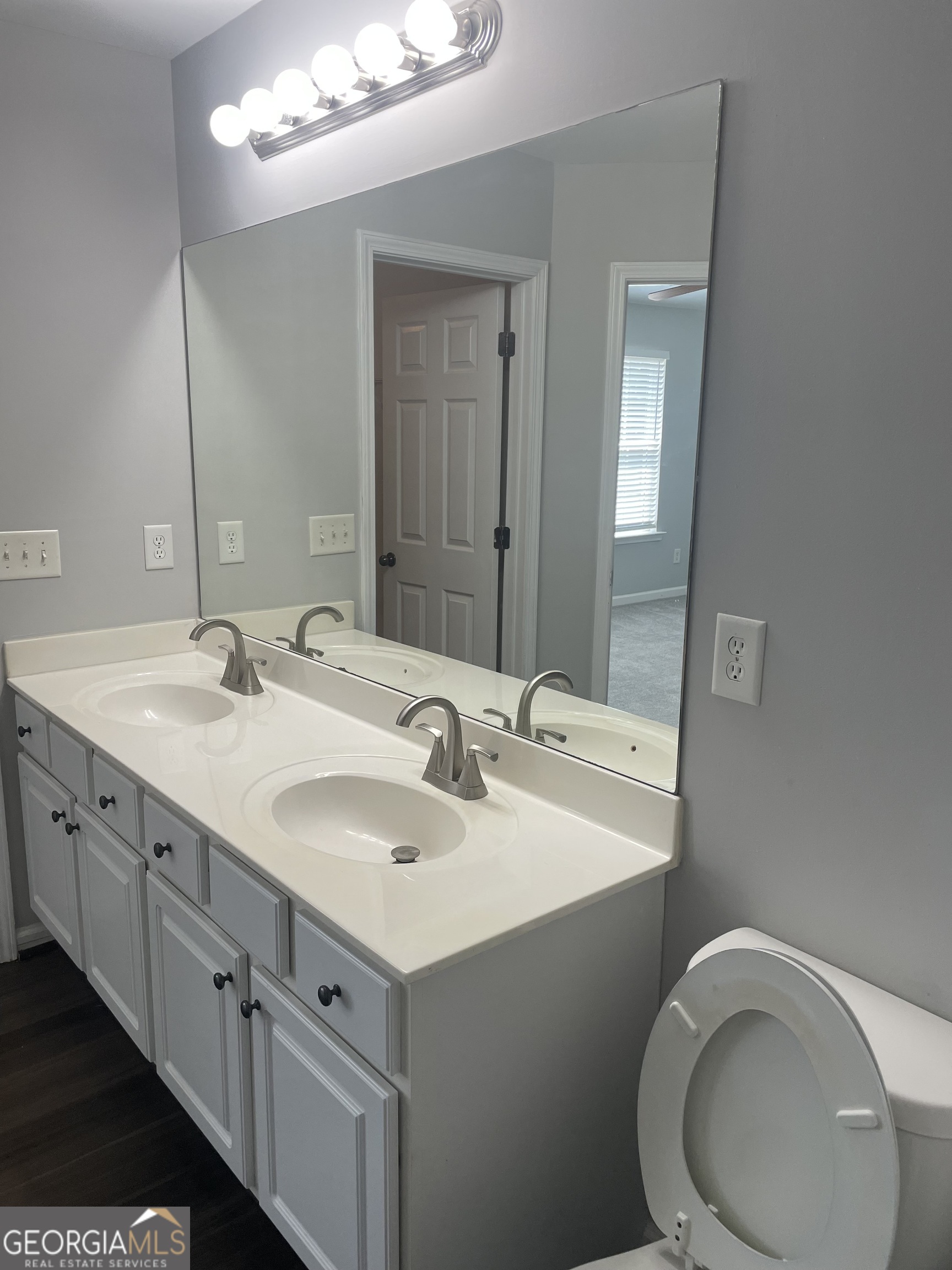 3640 Utoy Drive Southwest South Fulton, GA 30331 - Photo 20 of 26 a bathroom with a double vanity sink and a mirror