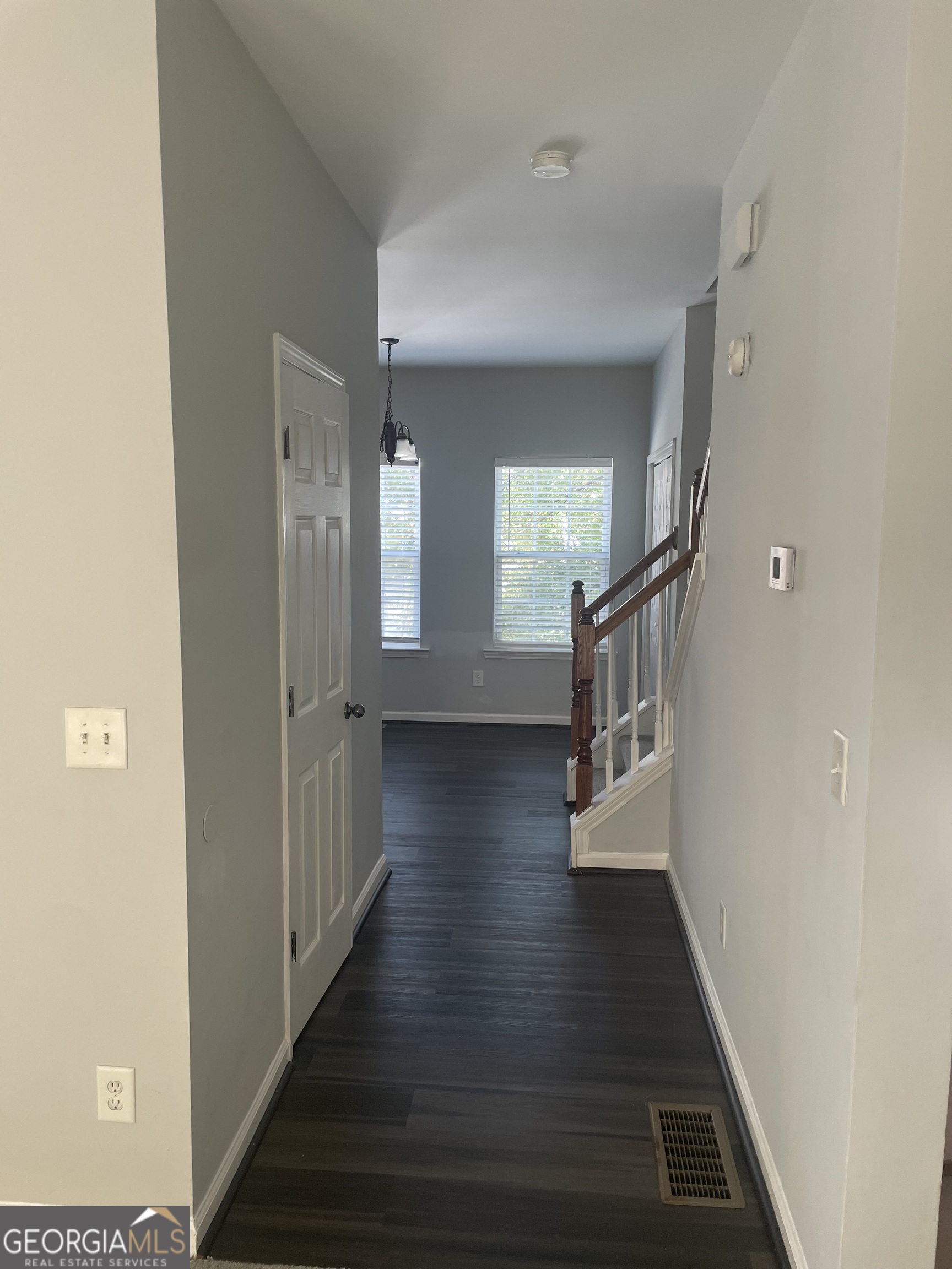 3640 Utoy Drive Southwest South Fulton, GA 30331 - Photo 25 of 26 a view of a hallway with wooden floor and staircase